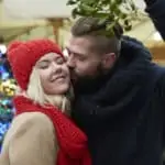 couple kissing under the mistletoe